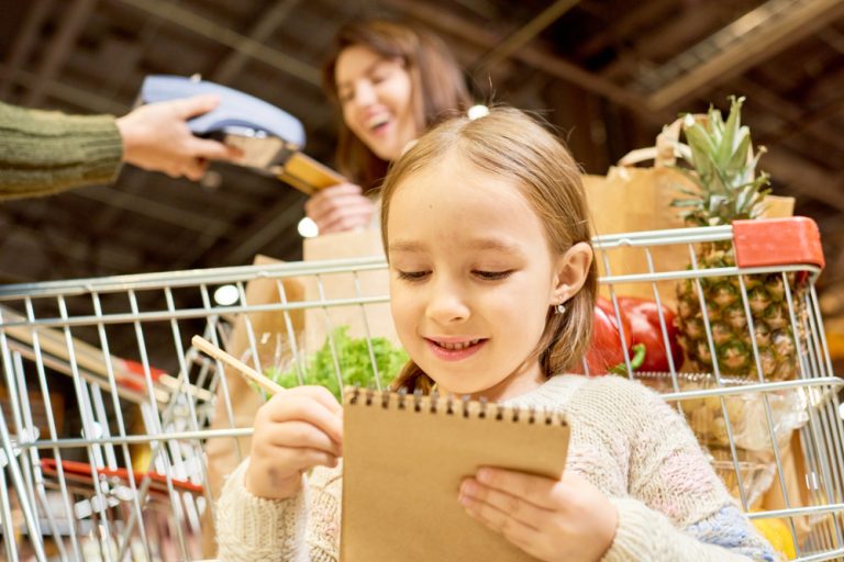 Warm-toned,Portrait,Of,Family,Doing,Grocery,Shopping,In,Supermarket,,Focus